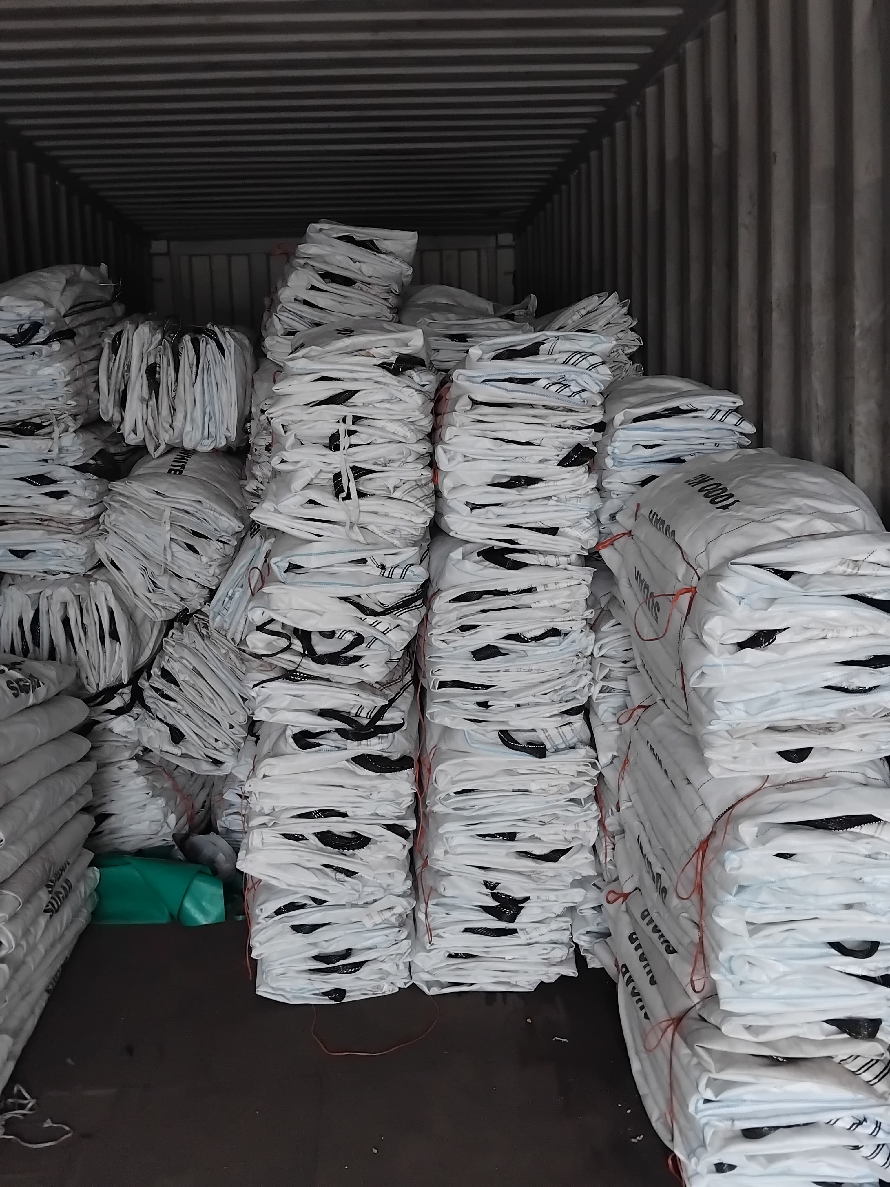 Bulk bags stacked in warehouse storage