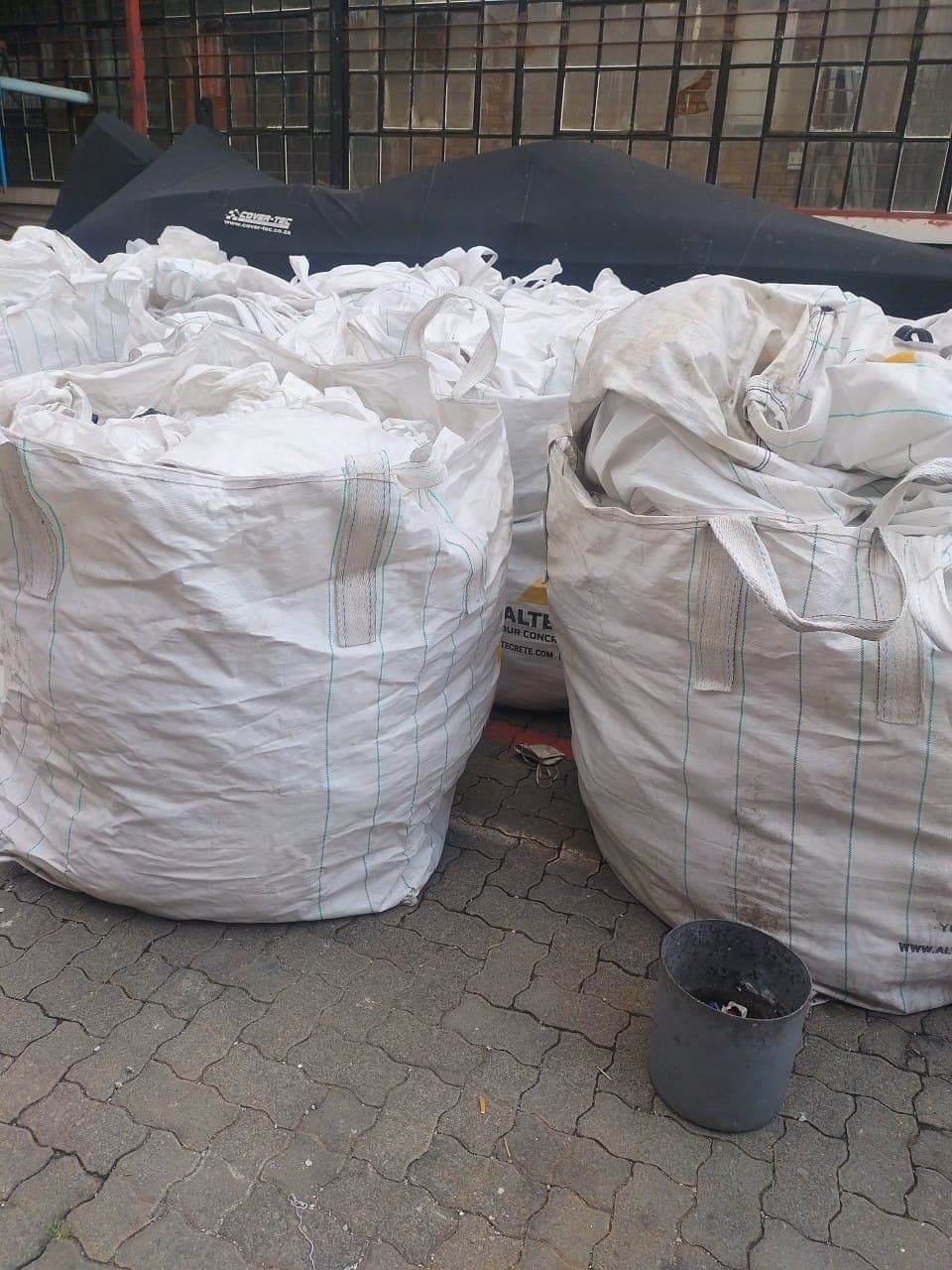 Used bulk bags stacked for resale and buy-back enquiries